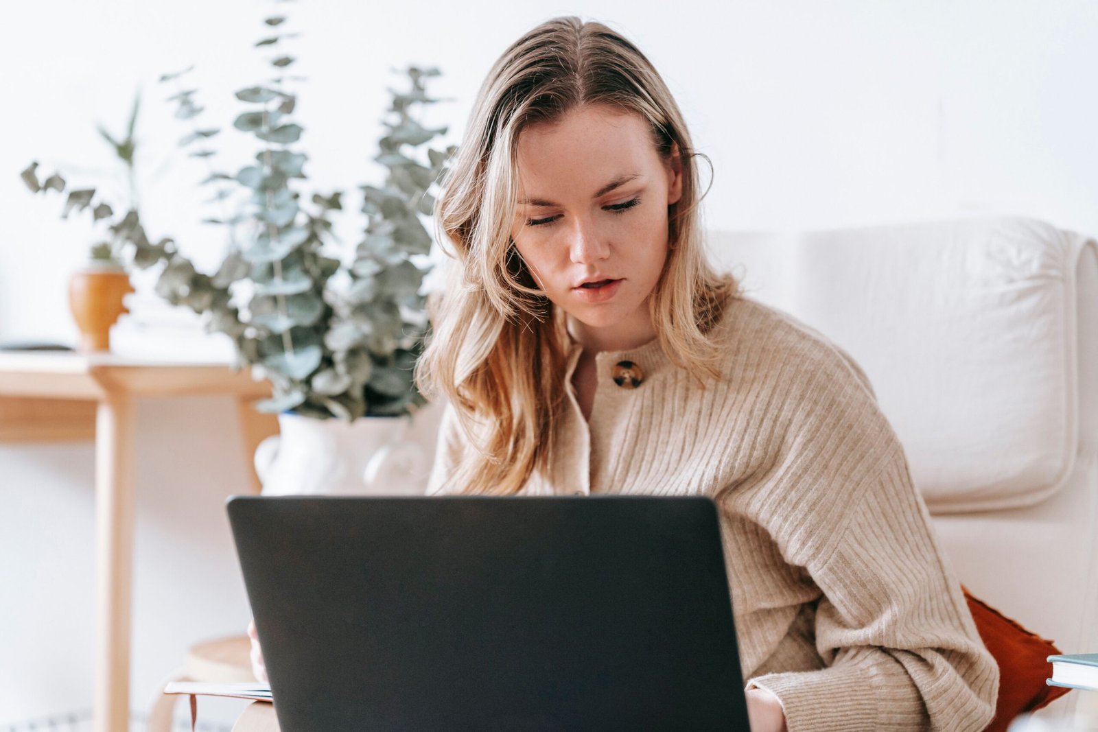 Freelancer using AI tools to work on a laptop at home
