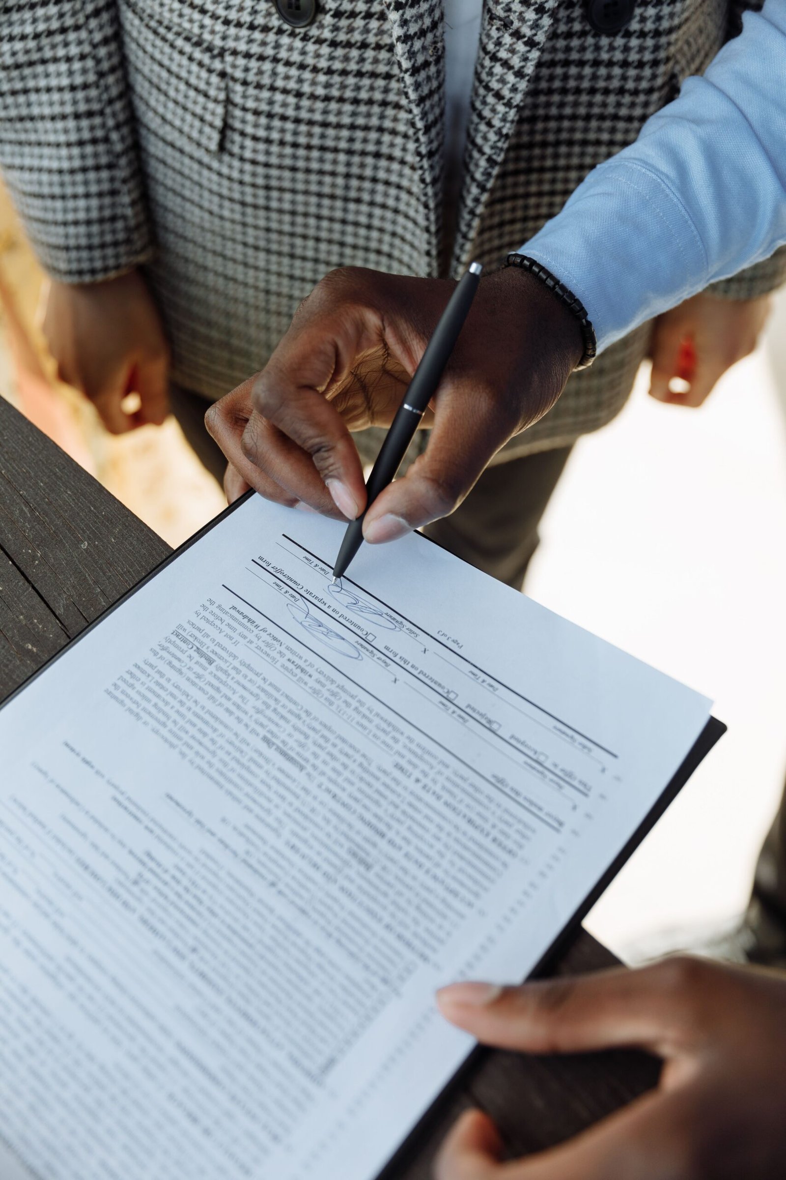 Signing a personal loan agreement for debt consolidation