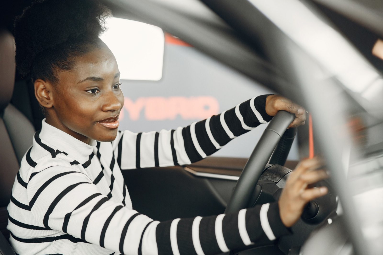 Young driver behind the wheel of a car