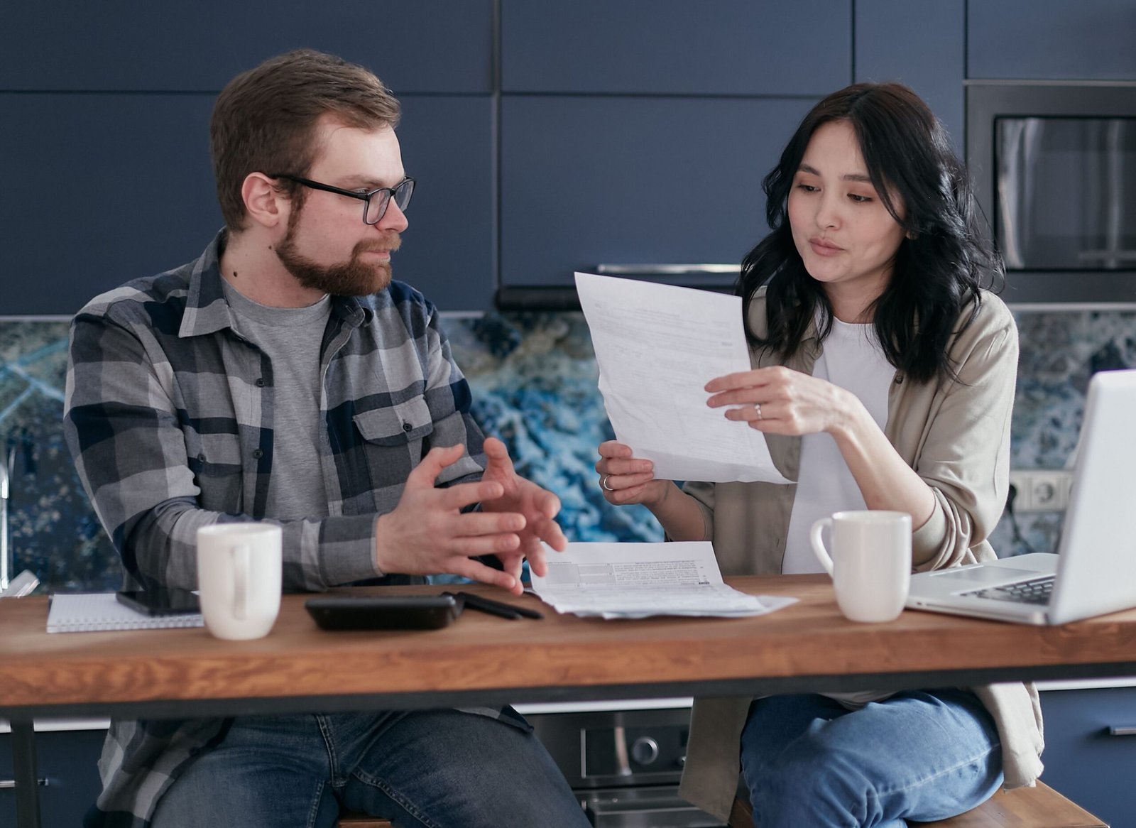 Canadian couple comparing investment apps and account options