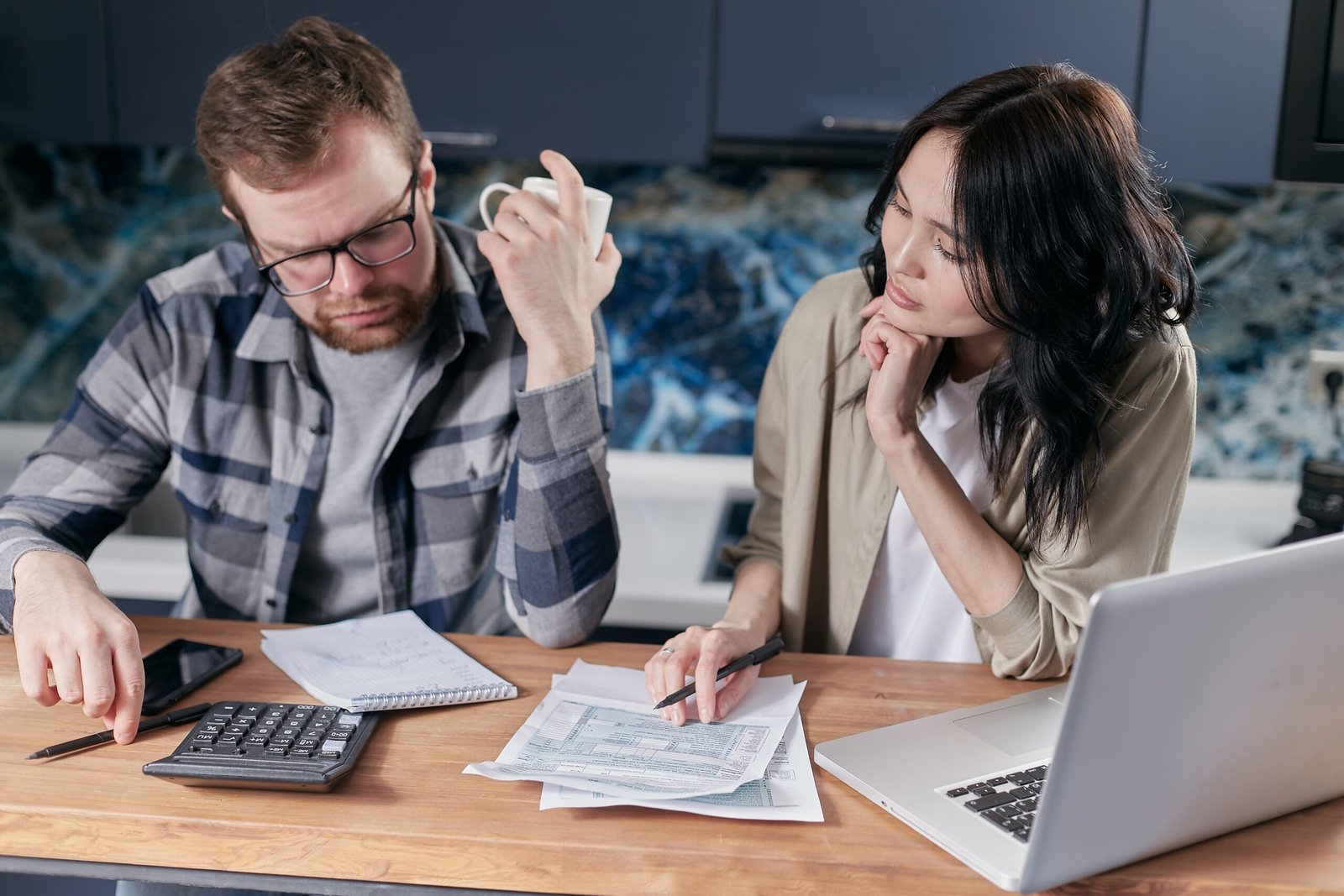 Couple reviewing household finances together using a budgeting app