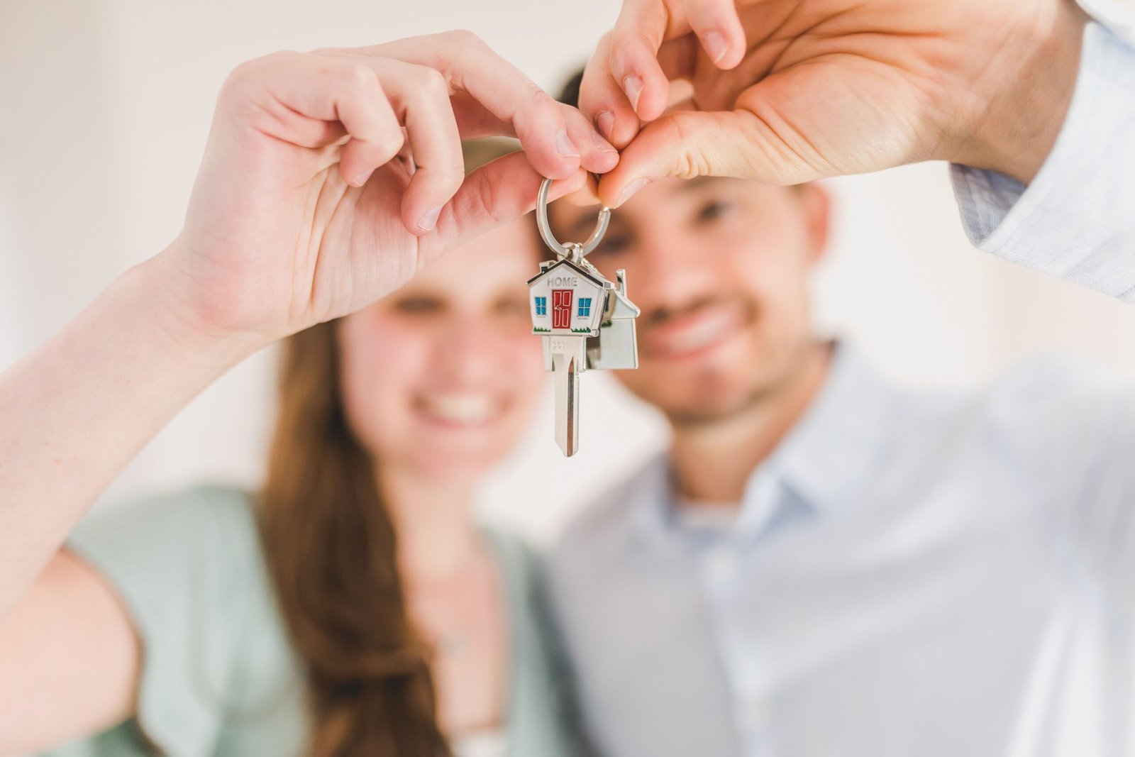 First-time home buyers holding the keys to their new house