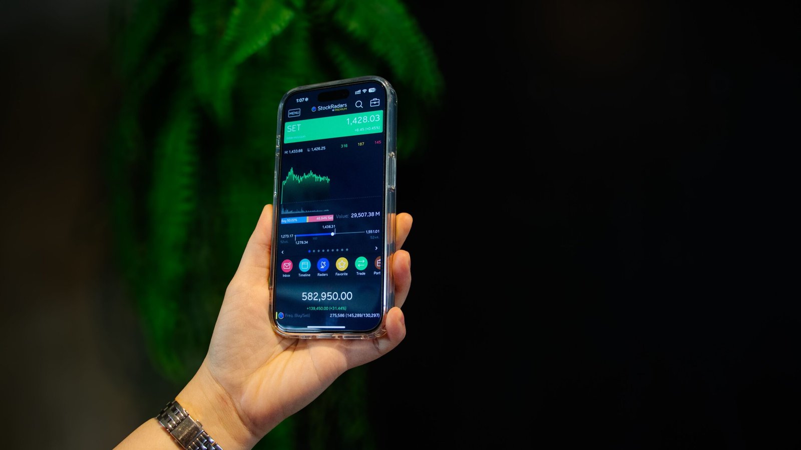 Stock trading app on a smartphone showing a beginner portfolio