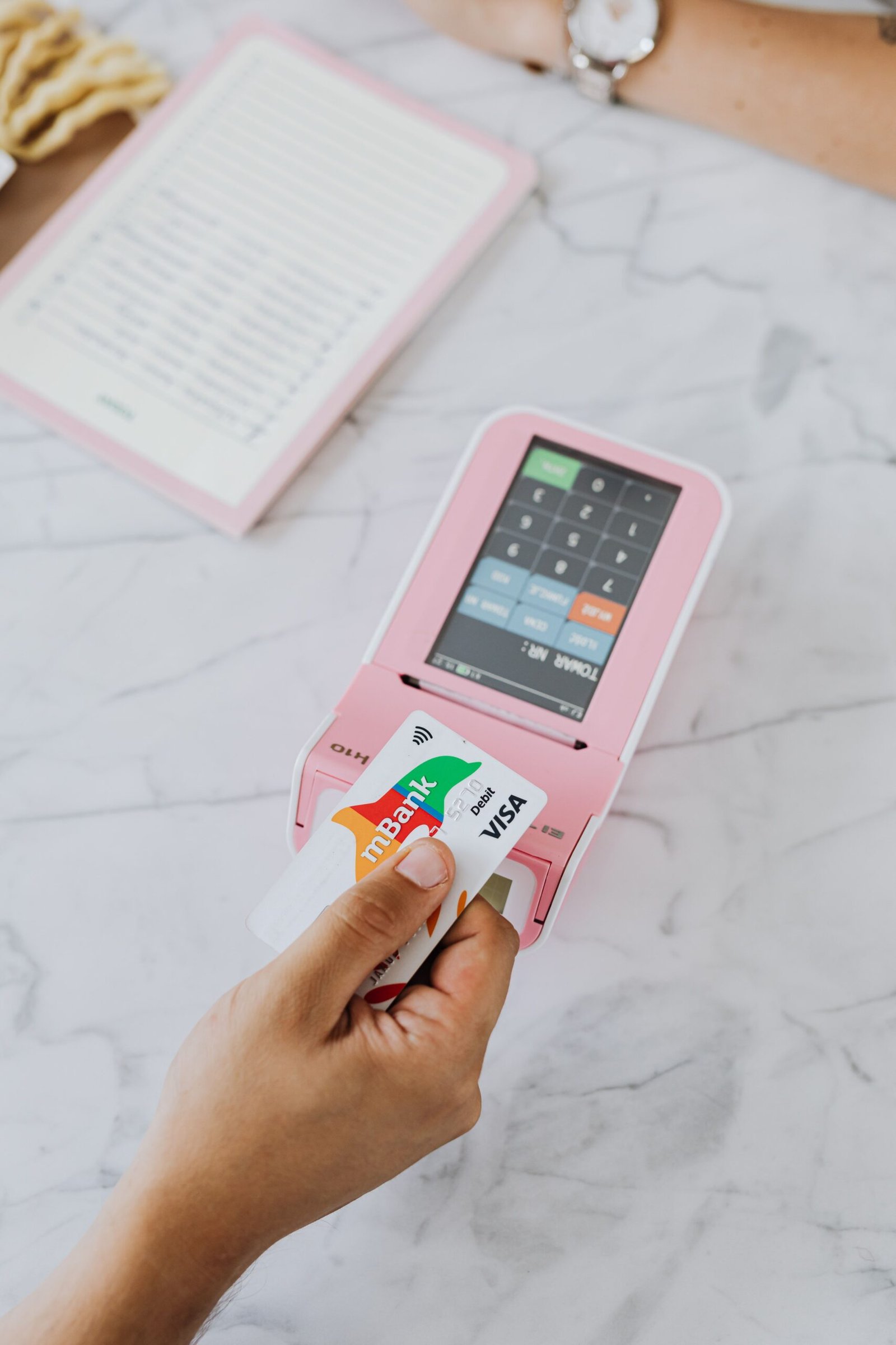 Paying by card at a terminal, adding to the balance credit card interest is calculated on