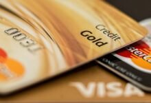 Stack of credit cards showing how credit card interest is calculated on balances