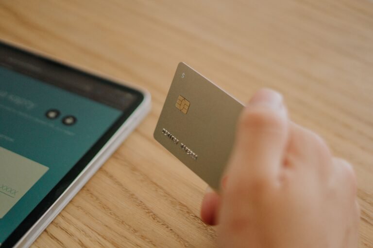 Person holding their first credit card after approval