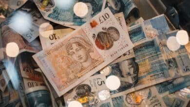 British pound notes representing £1,000 to invest